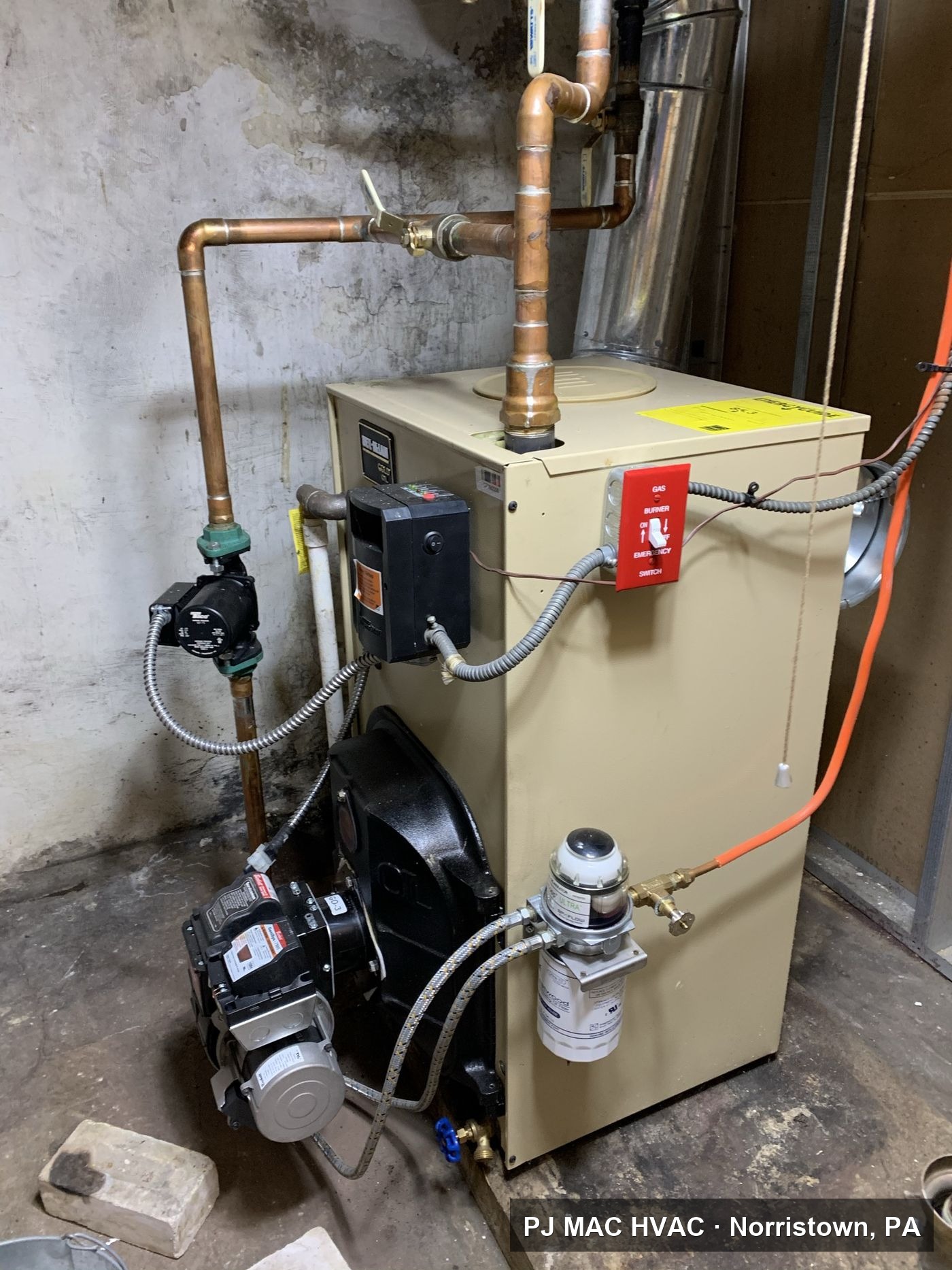 A basement boiler with new copper piping and circulator pump installed by PJ MAC HVAC.