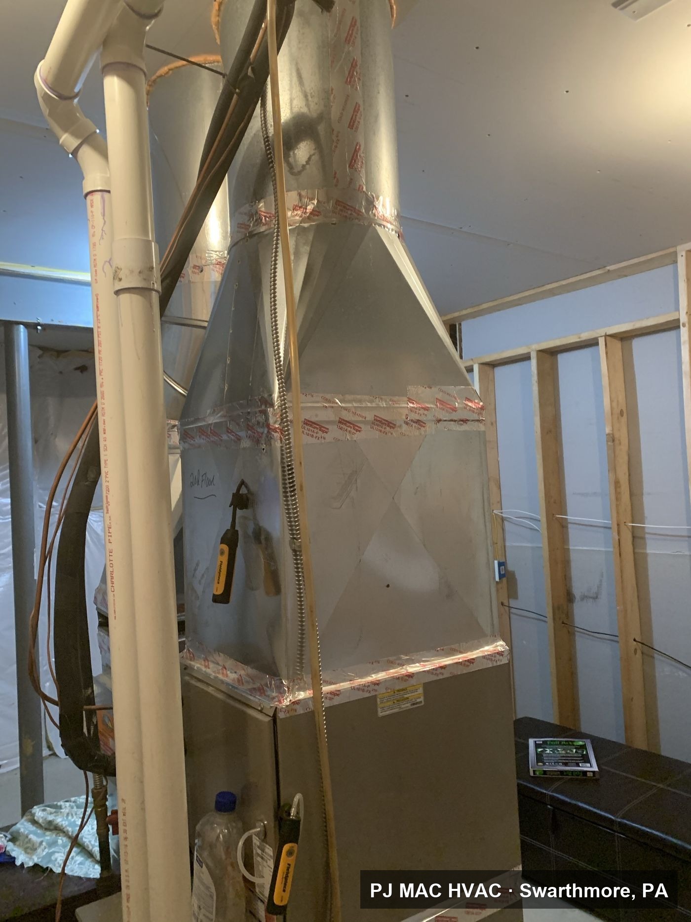 Custom sheet metal plenum work by PJ MAC HVAC on a basement furnace installation.